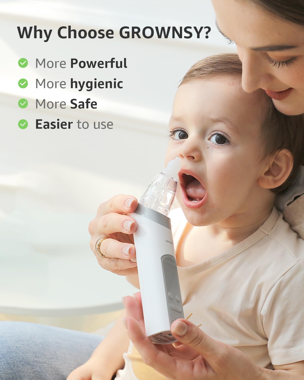 Close view of the GROWNSY electric aspirator used on a child