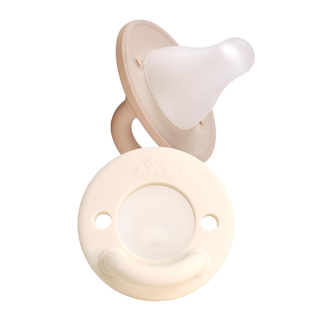 Taupe Itzy Ritzy breastlike nipple beside the cream shield back, with two holes and a handle